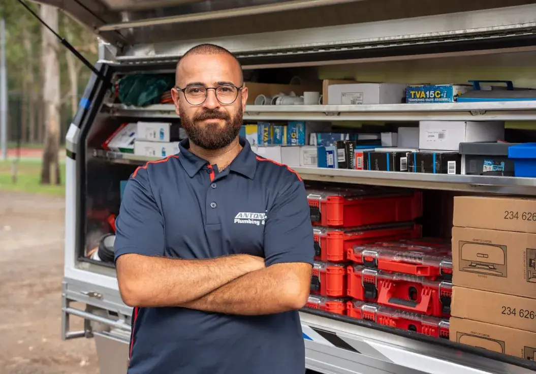 Licensed Ryde plumber from Antons beside a stocked service vehicle