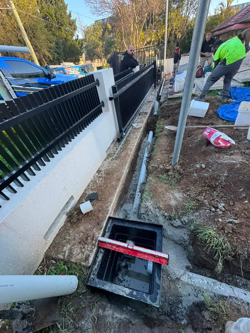 The Ryde Plumber by Antons team installing drainage beside a home